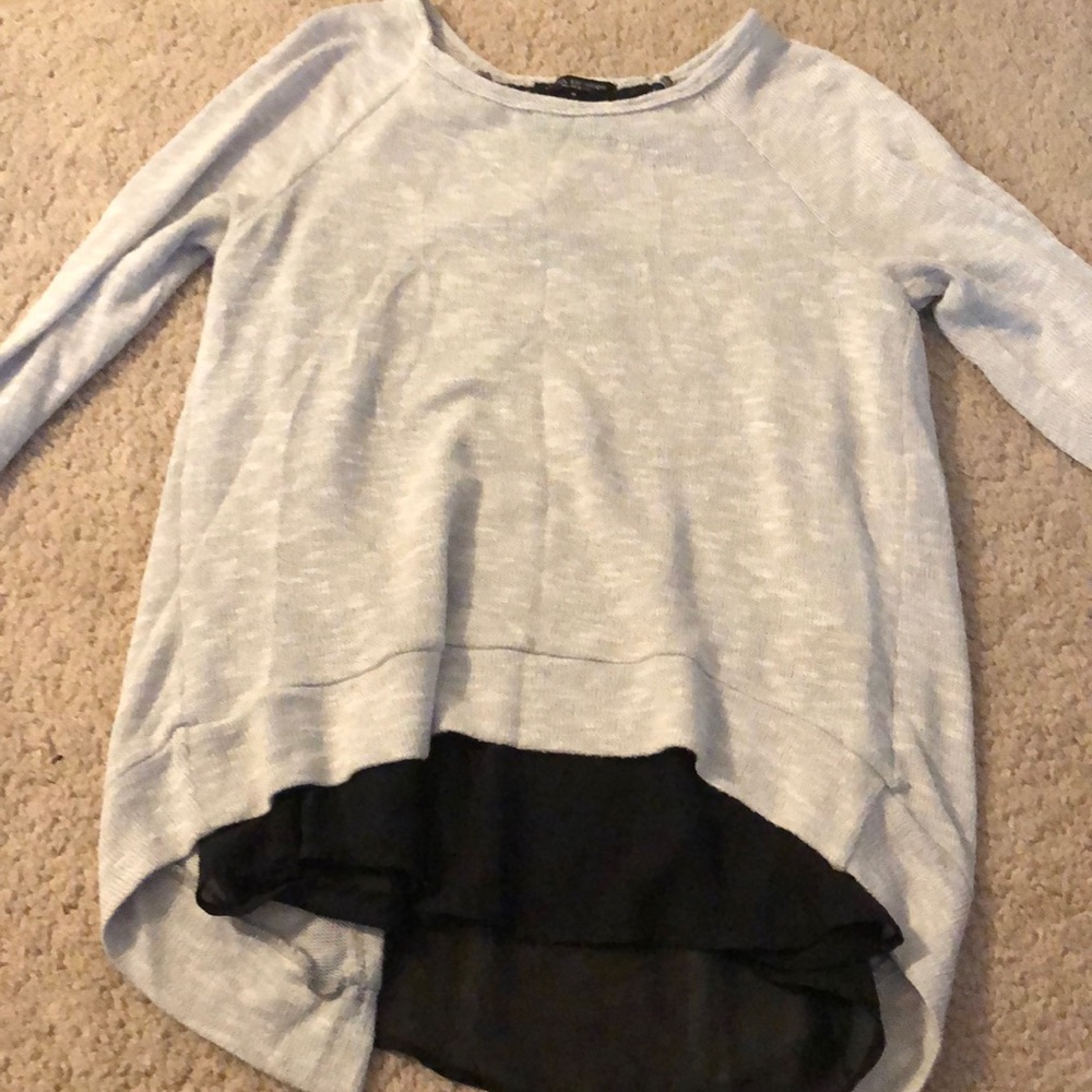 Grey sweater with black underlining